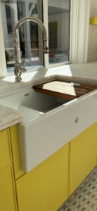 Charlotte plumber installing a cast iron sink and kitchen faucet