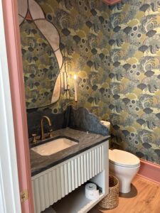 Charlotte plumber installing a luxury faucet and sink in a powder room