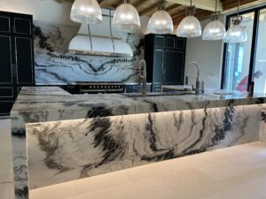 Stunning luxury Charlotte kitchen with custom plumbing, elegant fixtures, and a beautifully designed island