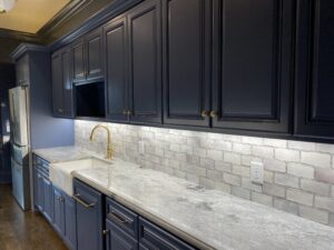 luxury bar sink with long bronze faucet and dishwasher installed by expert plumber