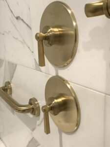 luxury bronze shower installation with rohl perrin rowe fixtures in custom bathroom